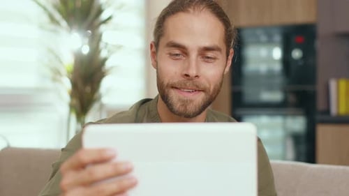 Man Using a Tablet to Video Chat