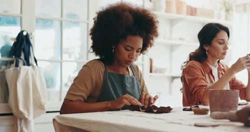 Pottery, class and women with clay for learning art, handmade craft and design process in workshop