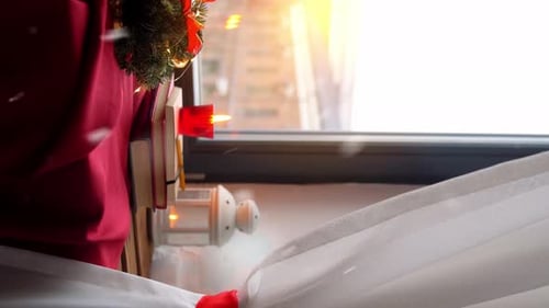 Christmas Decoration and Garland by Window at Sunrise