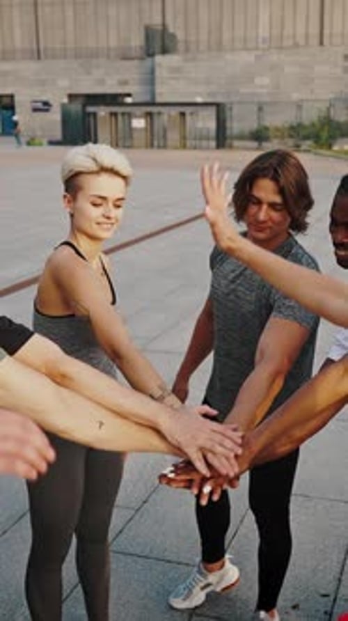 Diverse Group of Friends Put Hands Together