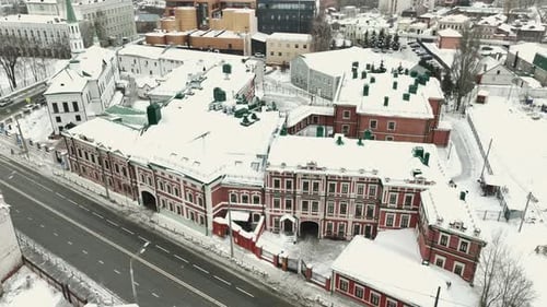 Traffic Road Lined with Vehicles Surrounding Buildings in City