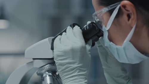 Female Scientist with Microscope