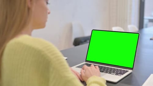 Woman Working on Laptop with Green Screen Chroma Key