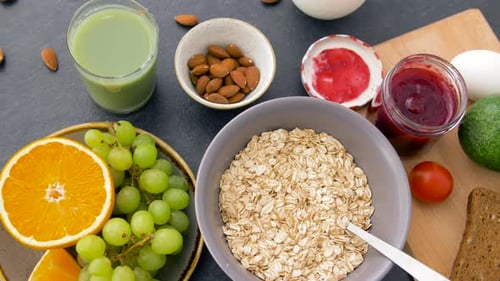Food, Healthy Eating And Breakfast Concept - Oatmeal Cereals, Fruits And Vegetables, Green Smooth...
