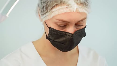 Medical Professional Wearing Face Mask in Clinic