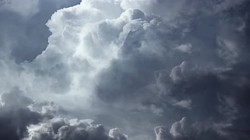 Majestic White Clouds Moving in the Blue Sky
