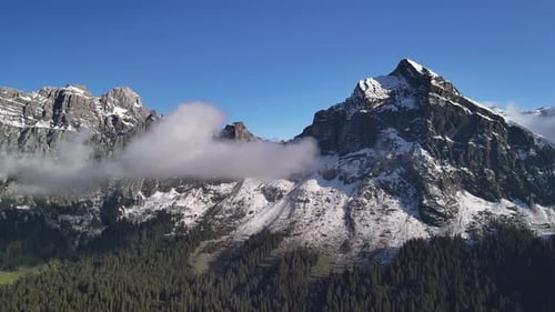 Swiss Alps with snow, Fronalpstock Glarus Switzerland mountains range aerial