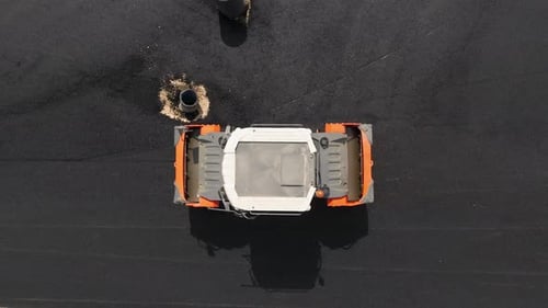 Road roller pressing fresh put Asphalt on a new road