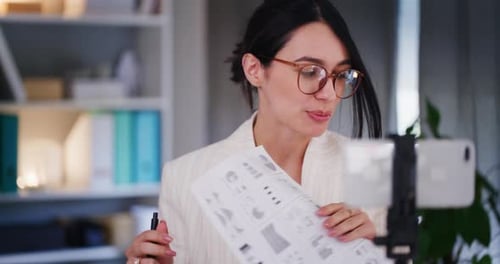 Woman Giving Online Presentation in Modern Office