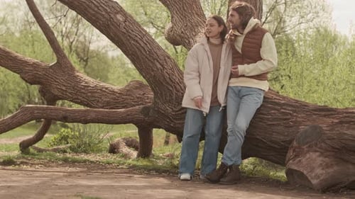 Romantic Couple Standing by Tree in Park