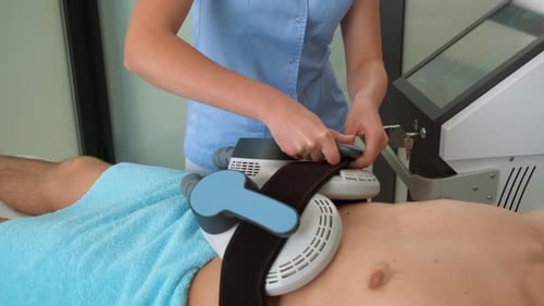 Medical Procedure on Man in Hospital Room