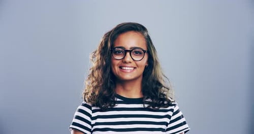 Smiling Woman Makes Heart Shape With Hands
