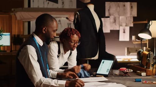 Two Tailors Choosing Fabric for Clothes