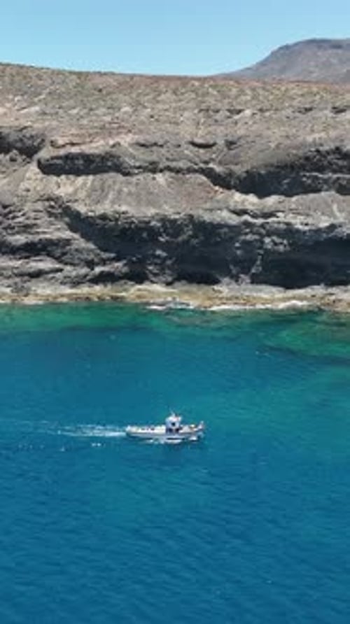 Fishing boat sailing in Puerto de las Nieves bay, Agaete, Gran Canaria