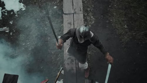 Knight with Two Swords Fighting Against Advancing Enemies in Castle