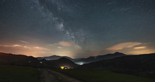 Starry Night Sky with Milky Way Galaxy in Countryside Landscape Astronomy Time Lapse Stars