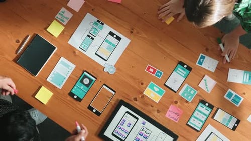 Top view of developer team working together to plan Ux Ui design. Convocation.