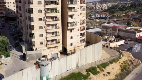 Security wall with Israeli idf watch tower Close to Shuafat Refugee Camp- Aerial
