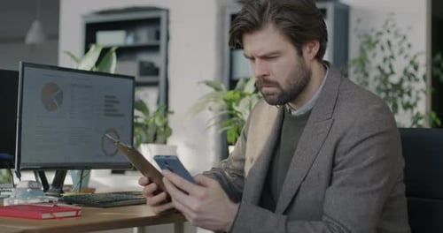 Man Working with Data at Urban Workplace