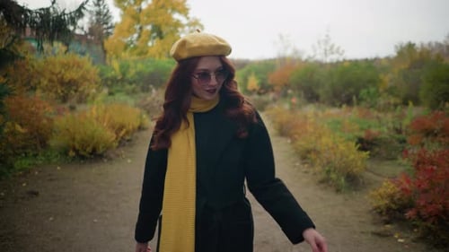 Autumn Stroll Stylish Student Adjusts Sunglasses in Garden