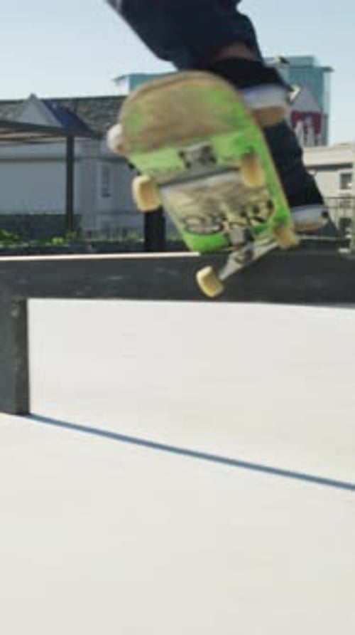 Legs, ride and jump with skateboard in city, training and athlete with skill development