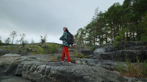 Woman Hiking on Rocky Tropical Island Landscape