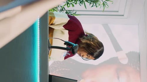 Vertical Video Asian Client Preparing to Pay for Clothes at Cash Register