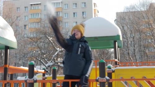 Happy and Active Boy the Playground in Winter