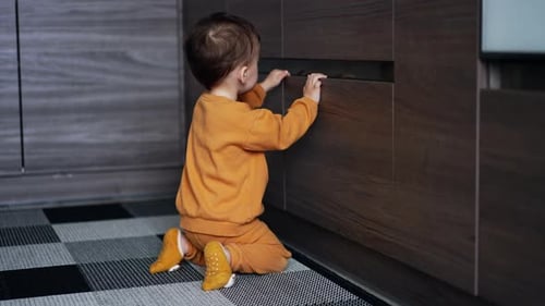 Cute Child Exploring and Playing at Home