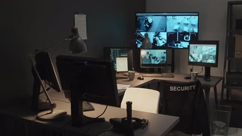 Modern Security Office with Multiple CCTV Monitors