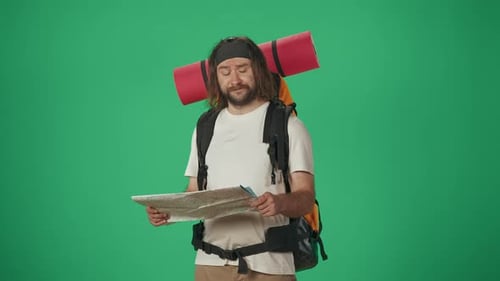 Lost Hiker Reading Map On Green Screen