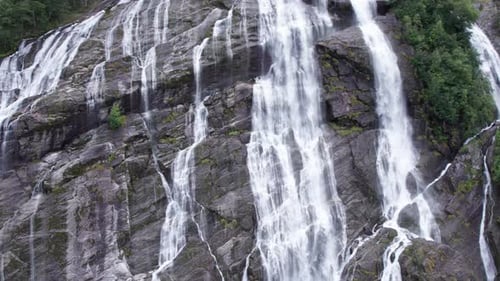 aerial view of norwegian mountains and waterfall