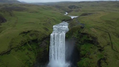 Beautiful aerial view from Skogafoss waterfall in Iceland and Skoga river during summer in an incred