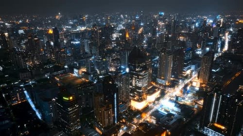 Stunning aerial view of a vibrant city skyline at night
