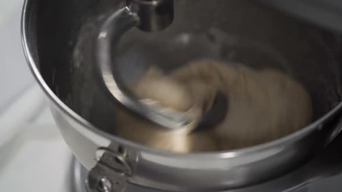 Mixing Ingredients in a Kitchen Standing Mixer to Bake Cinnamon Rolls