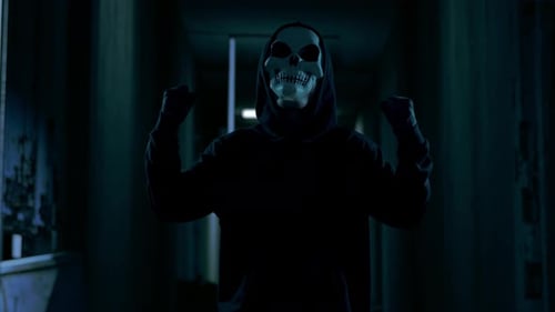 Close Up Of Scary Man In The Hooded Wearing Ghost Mask Laughing And Celebrating, Horror Scene