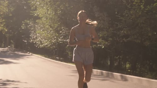 Woman Jogging in Park