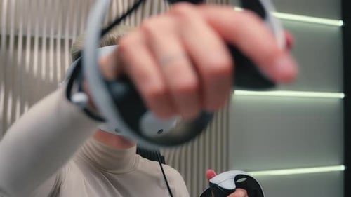 Woman Using a Virtual Reality Headset Indoors
