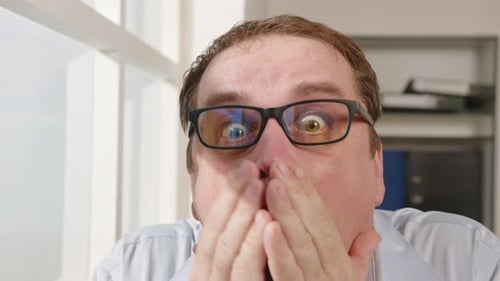 Man Reacting with Surprise and Taking off Glasses