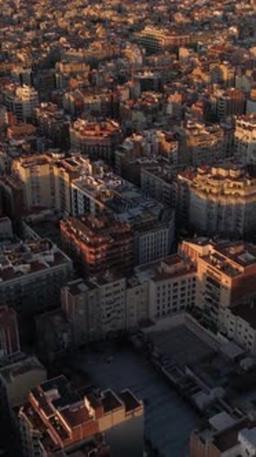 Vertical Video of Barcelona Skyline Building at Sunrise Aerial