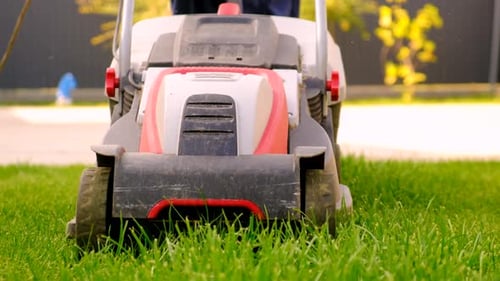 A Lawn Mower Mows the Lawn Selective Focus