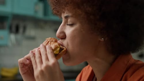 Black Woman Eating Burger Female Biting Yummy Cheeseburger Close Up Slow Motion