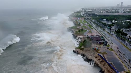 Violent waves pummel Caribbean coastline in Santo Domingo during hurricane Beryl