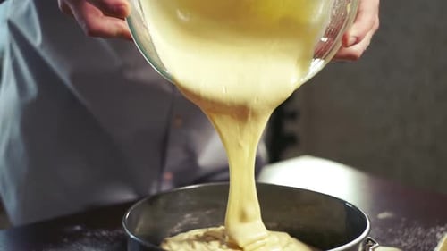 Cake Batter Pouring Into Baking Tin At Home