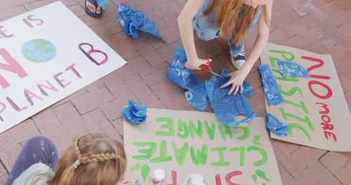 Children Crafting Climate Change Protest Signs