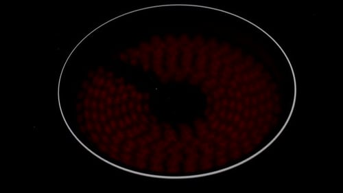 A shot of an electric hob or stove heating up and turning red.