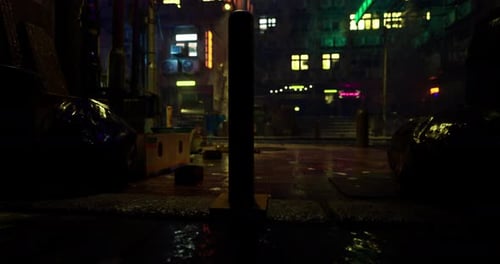 Urban Street at Night Showcasing Neon Lights and Reflections on Wet Pavement