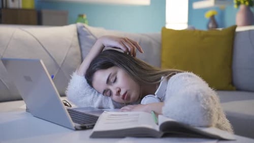 Tired Woman Studying with Laptop Falls Asleep