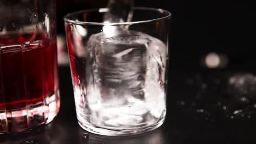 the bartender prepares a cocktail at the bar