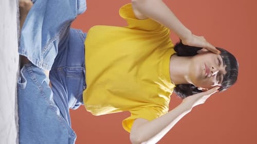 Woman with Headache Rubbing Temples in Vertical Video